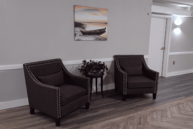 Comfortable lounge with three brown armchairs