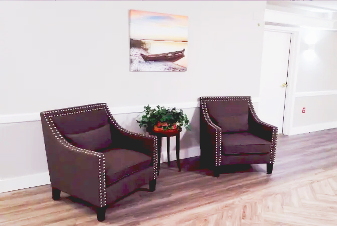 Comfortable lounge with three brown armchairs